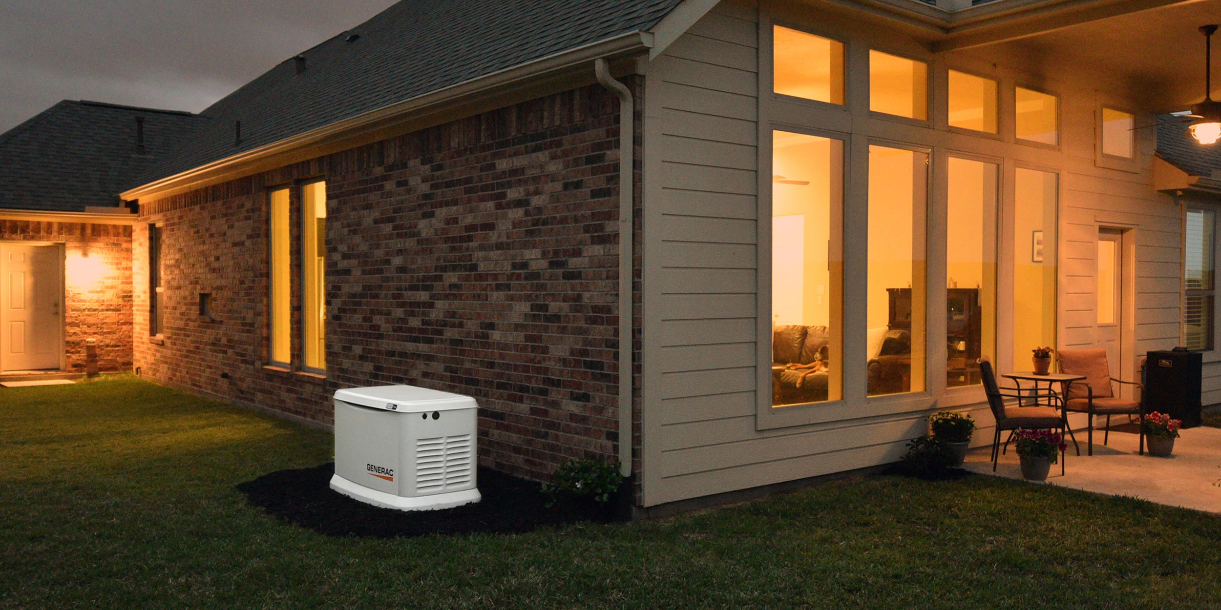 Generac standby generator installed beside a home